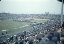 43rd Grey Cup game at Empire Stadium, scoreboard and three military marching bands on field