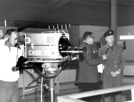 Canadian Army officer being interviewed in Armed Forces of Canada exhibit on P.N.E. grounds