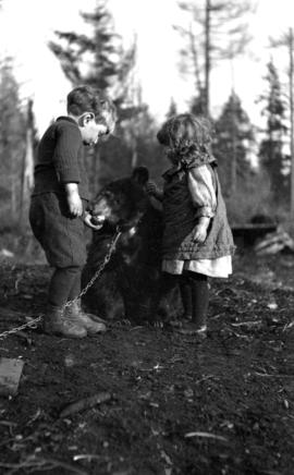 [Kenelm and Theresa Quiney with bear cub.]