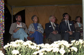 Group on stage at the lighting of the Peace Flame Monument ceremony