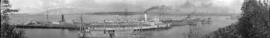 [View of Terminal Dock showing ships, railroad cars and dredging beside the partially complete do...