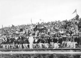 Fire Department Band performing by pool in front of bleachers