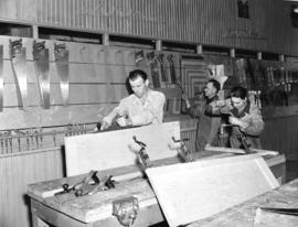 [Men doing wood work in a] Calgary trade school