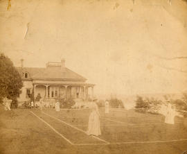 [Playing tennis on grass court at Benjamin Springer's residence]