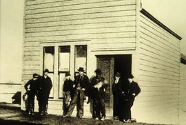 Group of men outside the Post Office on Hastings Street
