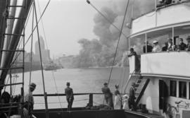 [View from a ship at the Union Steamship dock of the fire at Pier "D"]