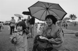 Woman and child with umbrella at Charleson Park