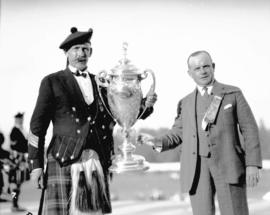 Caledonian Games [two men with "J.W. Stewart" cup]