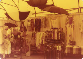 Clothing and umbrellas booth inside Canopy Mall