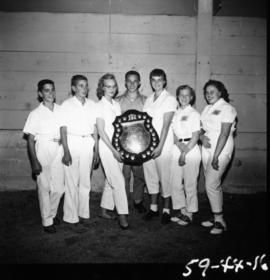 Children holding trophy from 1959 P.N.E. 4-H Clubs and Future Farmers of Canada Show
