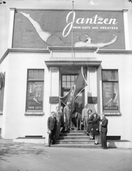 Jantzen plant salesmen and bond flag [on the front steps]