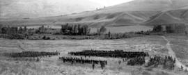 [View of an inspection of the 62nd Battalion near the training camp]