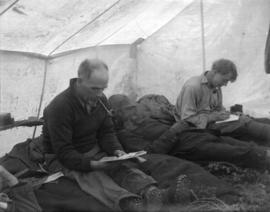 [Unidentified men in a tent]