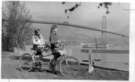 Patricia Beckett and Nancy Wherley with tandem bicycle in Stanley Park