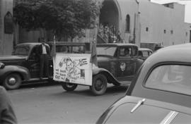 [Car decorated with flags and victory sign in Chinese parade during VJ Day celebrations]