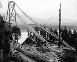 Erection of the first sections of steel for the roadbed where it enters Stanley Park.  Sections s...
