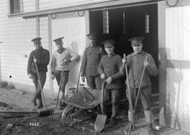 Group of soldiers with wheelbarrow tools [for cleaning stables]