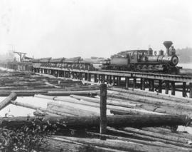 [Victoria Lumber Company steam train hauling logs from the waterfront]