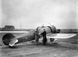 [James Wedell and William Templeton beside Wendell Williams Air Service Incorporated airplane]