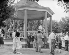 Canada Pacific Exhibition [A crowd around the bandstand while a band is performing]