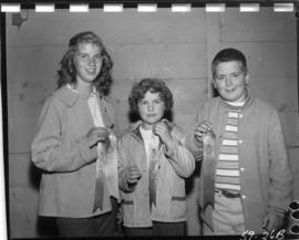 Children holding ribbons from 1959 P.N.E. 4-H Clubs and Future Farmers of Canada Show