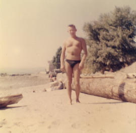 [Unidentified man wearing bathing suit at a Vancouver beach]