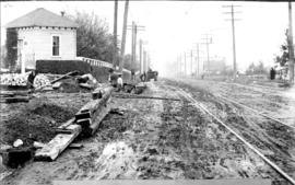 [View of road construction at the] Intersection - Fraser St. and 34th Ave. [now 33rd Avenue]