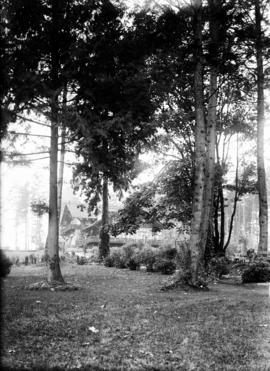 [View through the trees of the] Refreshment Pavilion, Stanley Park
