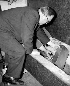 [Ralph O. Campney placing casket in corner stone at the new Post office]
