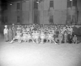[Group portrait of young skaters in costume at the Rotary Ice Carnival]