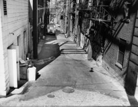 [View of alley between 100 block East Hastings and Pender Streets, looking west]