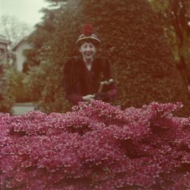 A woman and pink flowers at 3838 Cypress Street