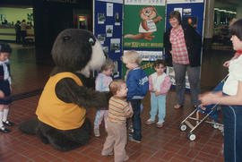 Tillicum interacting with children at Lougheed Mall