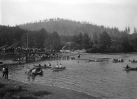 Hawick picnic [boaters and crowd on foot bridge]