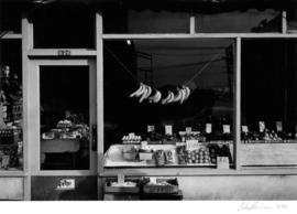 Grocery store front window, 626 Main Street