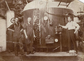 Three workers in pan house