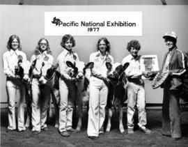 1977 P.N.E. 4-H Inter-Club Competition winners pose with livestock and prizes