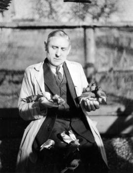 [Charles E. Jones holding Cedar Waxwings at Birds' Paradise]