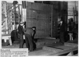 War work: deckhouse construction for Burrard Drydock-unloading steel plate