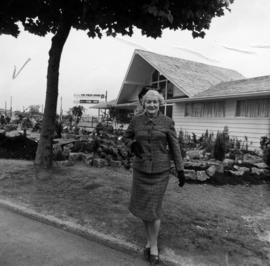 Woman by 1964 P.N.E. program prize house