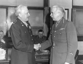 [Lieutenant General Kenneth Stuart greets a U.S. Army Officer]