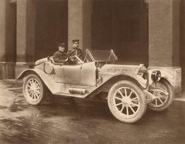 [Deputy Chief C. Thompson and driver seated in Fire Department automobile]