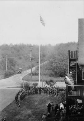 Col. Markham [Copy of a photograph of a group of military men around a flag pole]