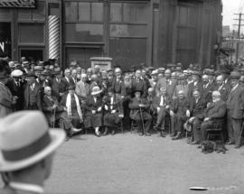 [Men and women gathered for the unveiling of the Maple Tree Monument at Carrall and Water Streets]