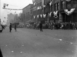 [Looking north on Granville Street from Georgia Street showing cars decorated for a parade]