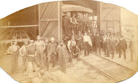 [Group portrait in front of C.P.R. repair shed and roundhouse near Pender and Carroll Streets]