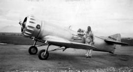[Pilot Earl Ortman beside] an experimental [air]plane named "Gilmore the Record Breaker&quot...