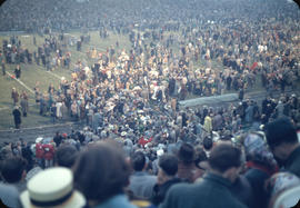 End of 43rd Grey Cup game at Empire Stadium, crowd and Edmonton Eskimo fans on playing field