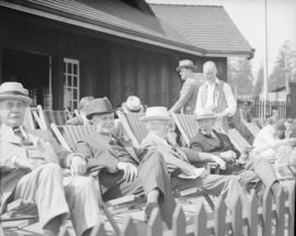 Cricket - Men in lounge chairs at the clubhouse