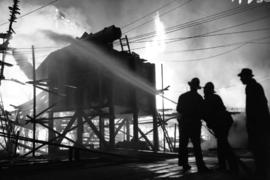 [Firemen fighting fire at Sterling Lumber Co., Powell Street]